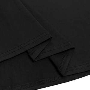 Detailed close-up of the double-needle hem and stitching on a black knit dress