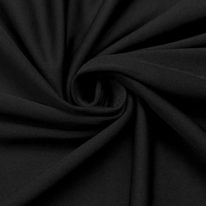 Close-up of high-quality black textile fabric with a subtle silk sheen and fine texture