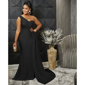 Detail of elegant black one-shoulder evening dress with pleated waist and mermaid silhouette