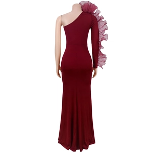 Back view of wine red one-shoulder fishtail dress with dramatic ruffled lace sleeve