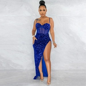 Detail of blue sequin dress featuring sheer mesh panel and slit high-waisted design