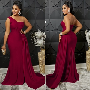 Detail view of burgundy one-shoulder evening gown with waist pleats and side drape