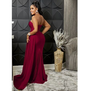Detail of burgundy evening gown showing the slim fit mermaid cut and backless design