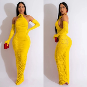 Detail of yellow halter evening gown with floral neckline and lace gloves
