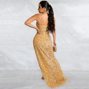 Detailed close-up of golden sequins on a slim fit mesh dress with open back style