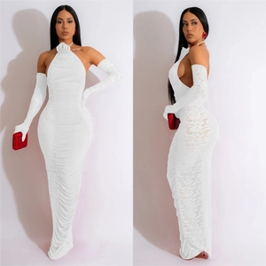 Detail of white halter neck dress with lace panels and floral collar accent