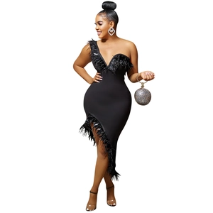 Close-up of elegant black feather trim on a one-shoulder V-neck evening party dress