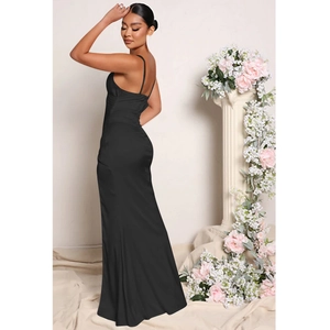 Detail of elegant black satin evening dress showing slim straps and backless silhouette