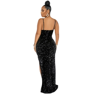 Detailed back view of a slim black sequin evening gown with spaghetti straps and side slit