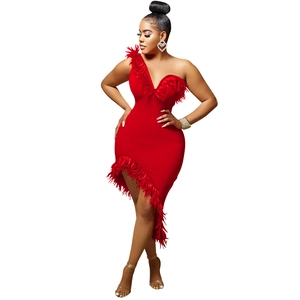 Detail of red one-shoulder dress featuring V-neckline and elegant feather trim accents