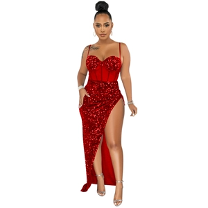 Detailed view of red sequin evening gown featuring high slit and spaghetti straps