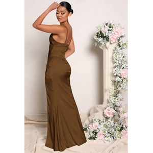 Detail of the back profile on this deep brown satin maxi dress with a slit hemline