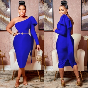 Royal blue one-shoulder dress with a large bow detail and elegant gold waist belt