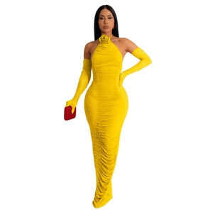 Detail of yellow ruched halter dress with 3D rose neckline and matching lace gloves