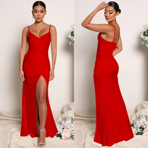Detail of red satin evening gown featuring slim straps, deep V-neck and high side slit