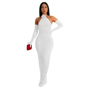 Close-up of white halter neck dress with 3D rose decor and matching lace gloves