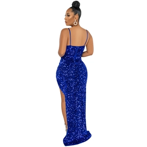Detail of royal blue sequined fabric on an evening dress with a side slit and backless cut