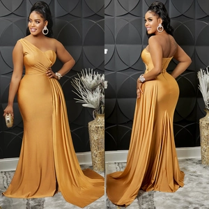 Detail of elegant gold one-shoulder satin evening gown with ruched waist and floor-length drape