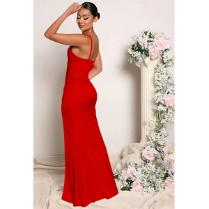 Detail of red satin evening gown showing the sleek back silhouette and thin straps