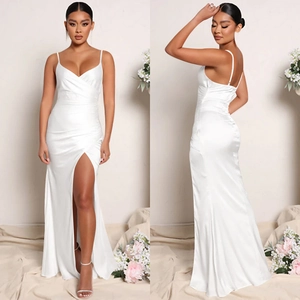Detail of elegant white satin long dress with V-neckline and high thigh-high slit detail