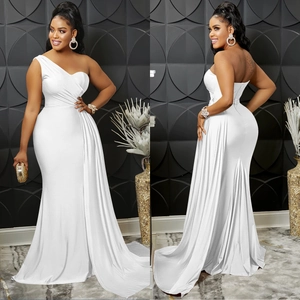 Detail of white one-shoulder evening gown featuring fine pleats and satin texture