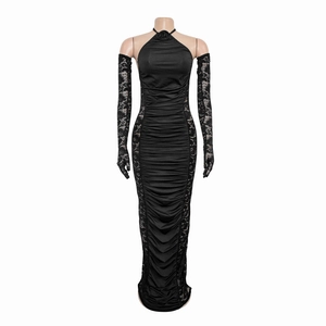 Detail of elegant black ruched halter maxi dress with 3D rose and lace gloves