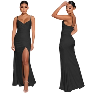Close-up detail of smooth satin fabric and high slit design on black evening dress