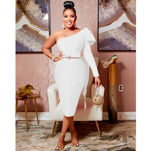 Detailed close-up of a white one-shoulder midi dress featuring a large decorative bow