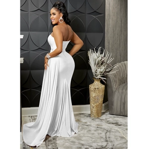 Detailed view of white mermaid evening gown with elegant long train and satin texture