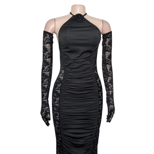 Close-up of black ruched halter dress with rose detail and matching lace gloves