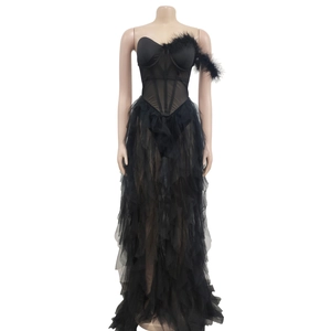 Close-up of black bustier evening dress with mesh layers and delicate feather details