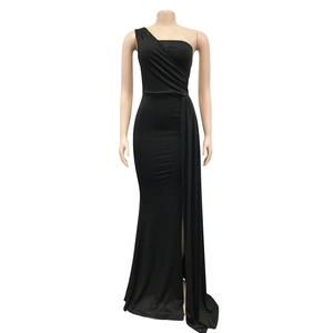 Detail of elegant black one-shoulder dress with slimming side ruching and slit