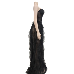 Detail view of the black mesh corset dress featuring feather trim and layered tulle