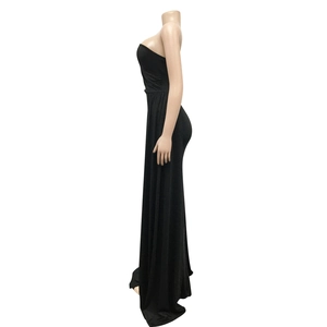 Side view of sleek black strapless long dress with fitted cut and flowing draped hem