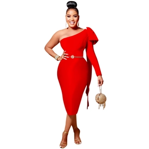 Detail of red one-shoulder dress featuring a large bow and elegant gold waist belt