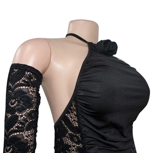 Close-up of halter dress neck featuring 3D flower detail and floral lace side panels