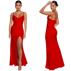 Detailed view of the red V-neck maxi dress featuring thin straps and a high side leg slit