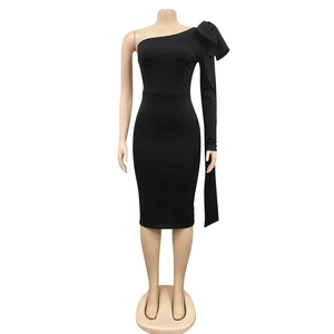 Detail of elegant black one-shoulder dress with large bow knot and pleated sleeve design