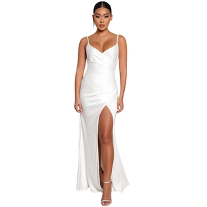 Close-up of the elegant side slit and smooth satin fabric on a white maxi dress