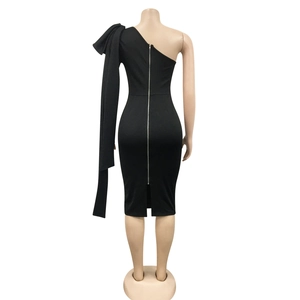 Detail of a black one-shoulder dress featuring a full-length silver back zipper and side slit