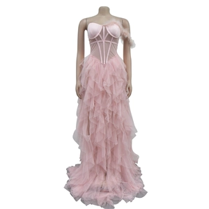 Detailed corset bodice of light pink mesh maxi dress with feathers and layered tulle