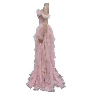 Detail of light pink tulle gown with feather trim neckline and corset bodice structure