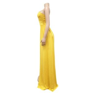 Detail view of bright yellow maxi dress showing high-waist pleats and A-line silhouette