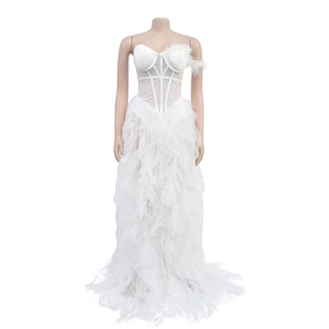 Detail of white strapless tulle dress with corset bodice and feather shoulder accents