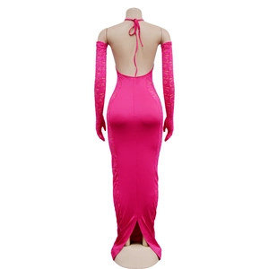 Detail of fuchsia backless dress with lace stitching and matching long gloves
