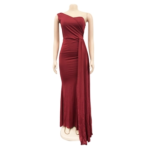 Detailed view of dark red one-shoulder fitted maxi dress with elegant side drape detail