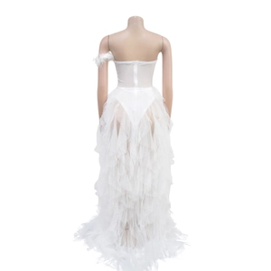 Detail view of the layered white mesh tulle skirt and back zipper closure on the dress