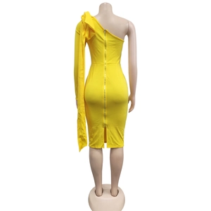 Detail view of the yellow midi dress showing the back metal zipper and shoulder drape