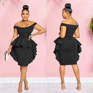 Detail of off-shoulder ruffled black dress showing elegant double-layered peplum hemline