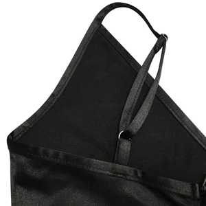 Detailed close-up of adjustable thin shoulder straps with silver rings on black satin dress